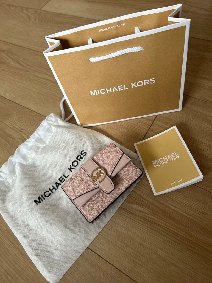 MICHAEL KORS ピンク GREENWICHフラップ トライフォールド
