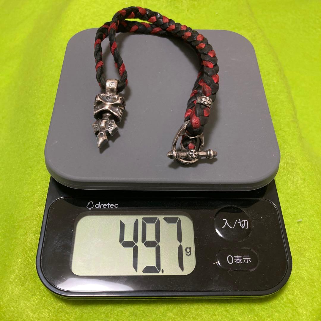 ビルウォールレザー　黒赤 編み革紐　スカルトップ
