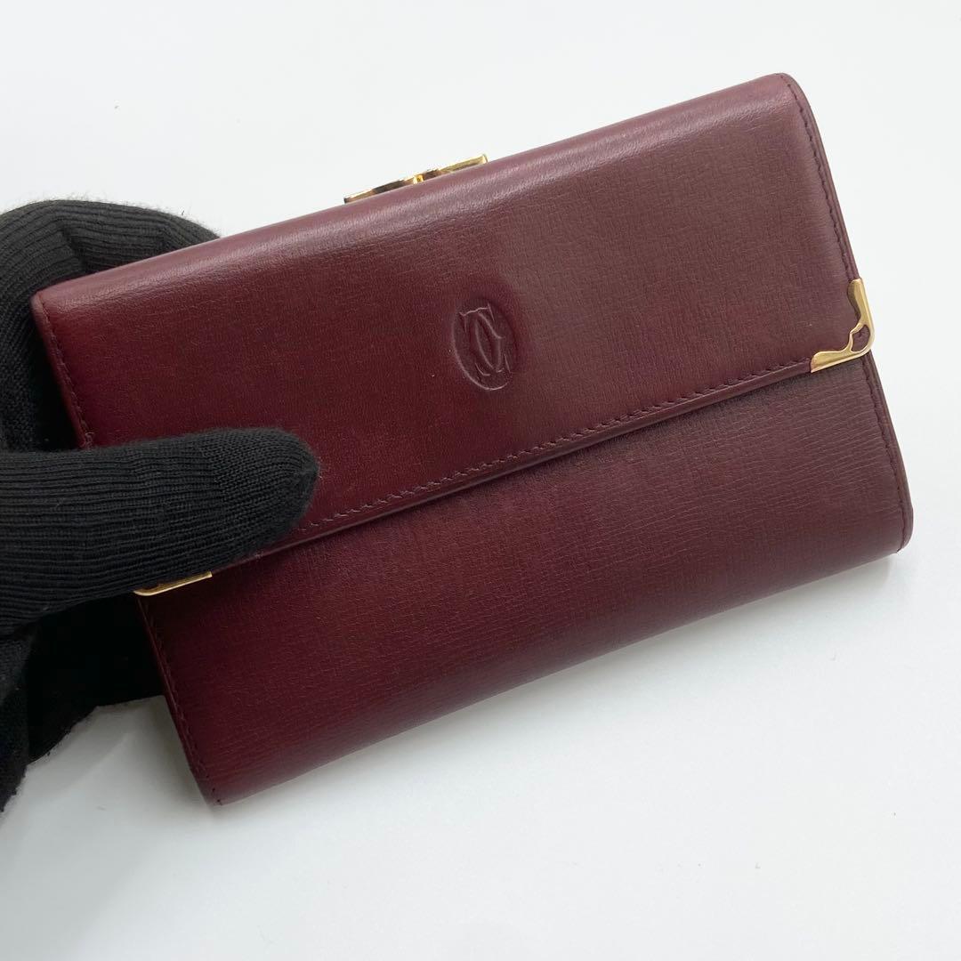 カルティエ　折り財布　がま口　ゴールド金具　マストライン　レザー　ボルドー