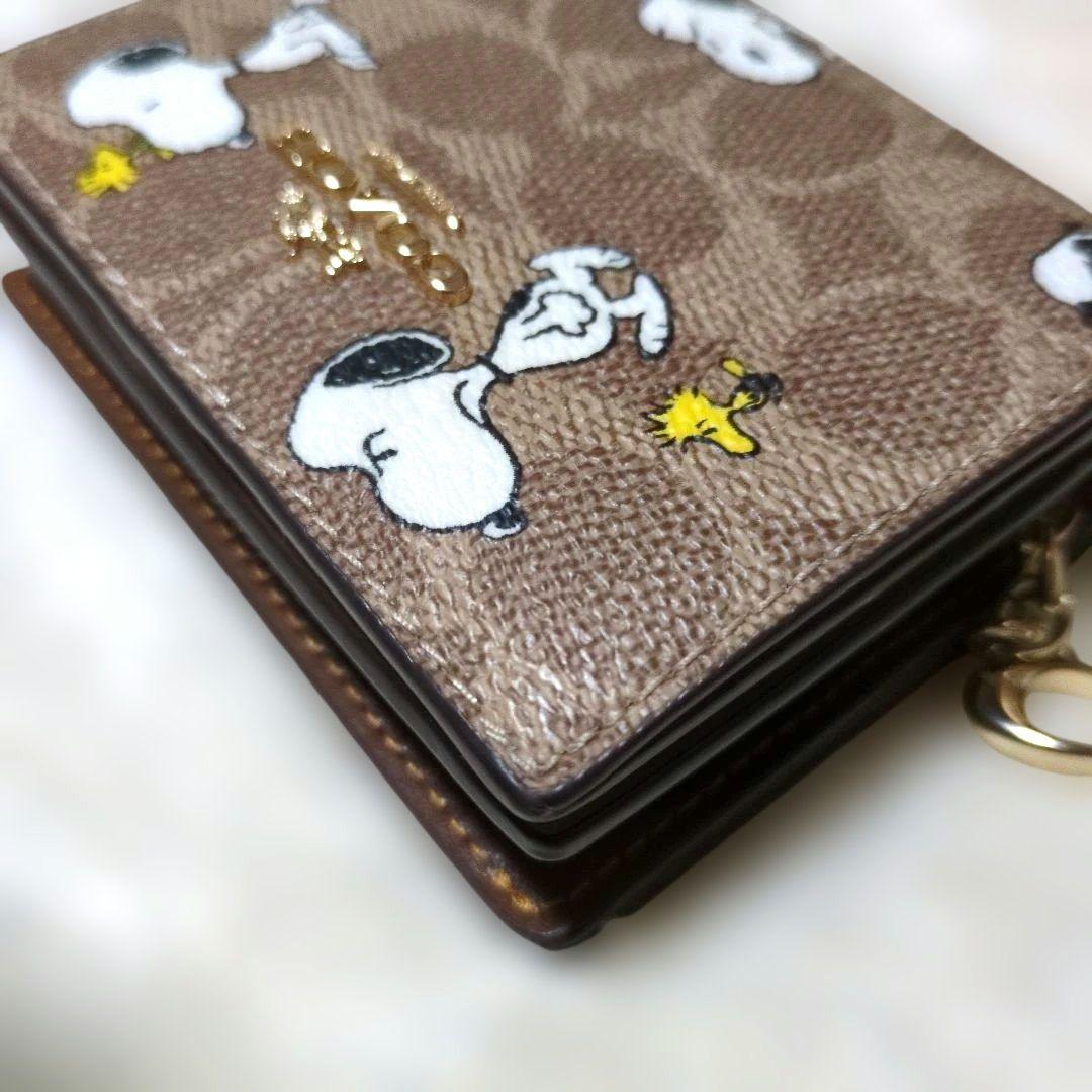 コーチ　スヌーピー　コラボ　二つ折り財布　シグネチャー