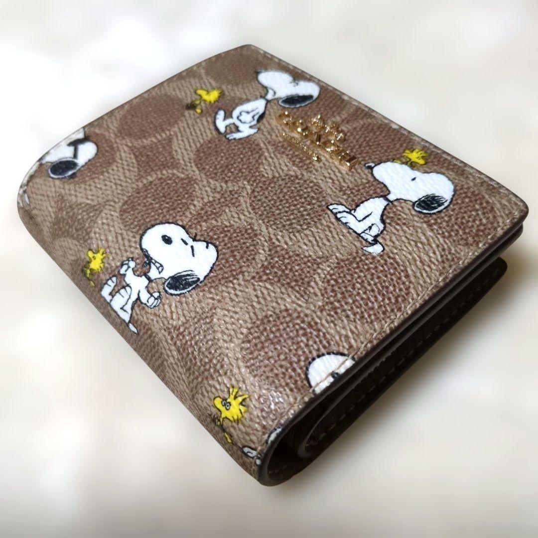 コーチ　スヌーピー　コラボ　二つ折り財布　シグネチャー