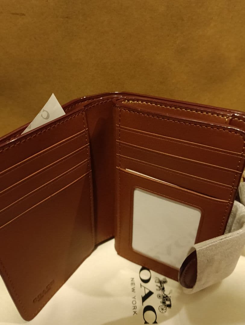COACH 花柄 二つ折り財布　ショッパー