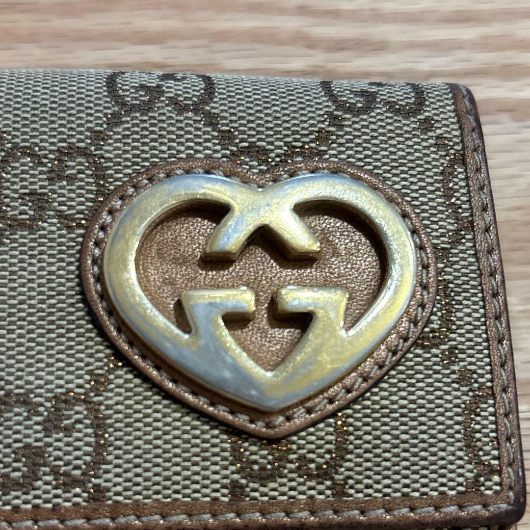 GUCCI グッチ 二つ折り財布 GG ハート キャンバス ロゴ ブロンズ