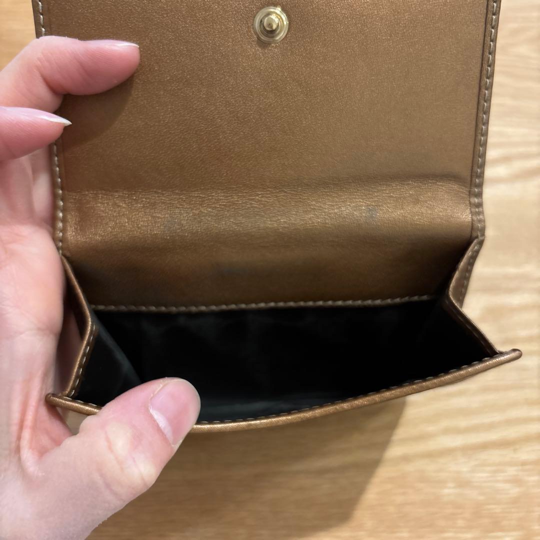 GUCCI グッチ 二つ折り財布 GG ハート キャンバス ロゴ ブロンズ