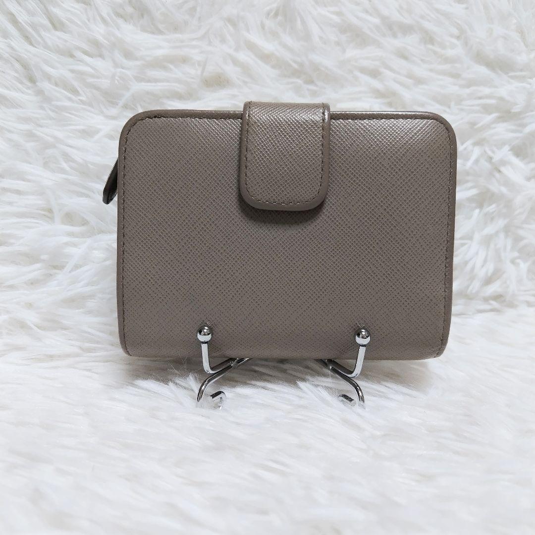 レア美品✨プラダ◇RFIDミディアムコンパクト二つ折り財布　りぼんグレーピンク