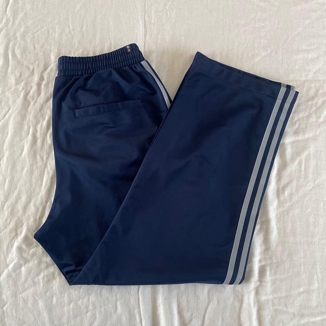 adidasアディカラー バギーフィット ファイヤーバードトラックパンツ