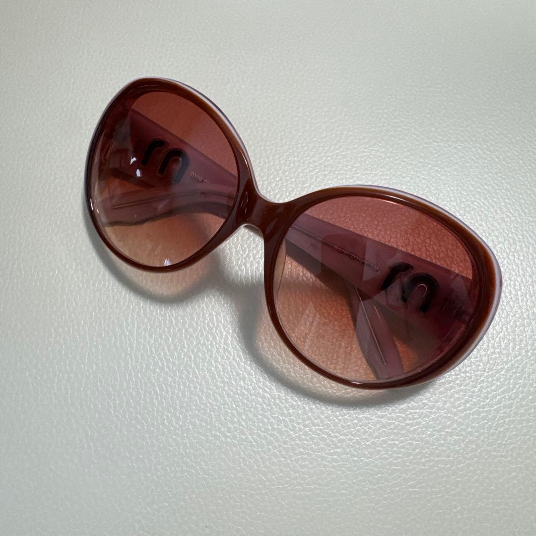 MIU MIU ラウンド型サングラス ピンク グラデーション