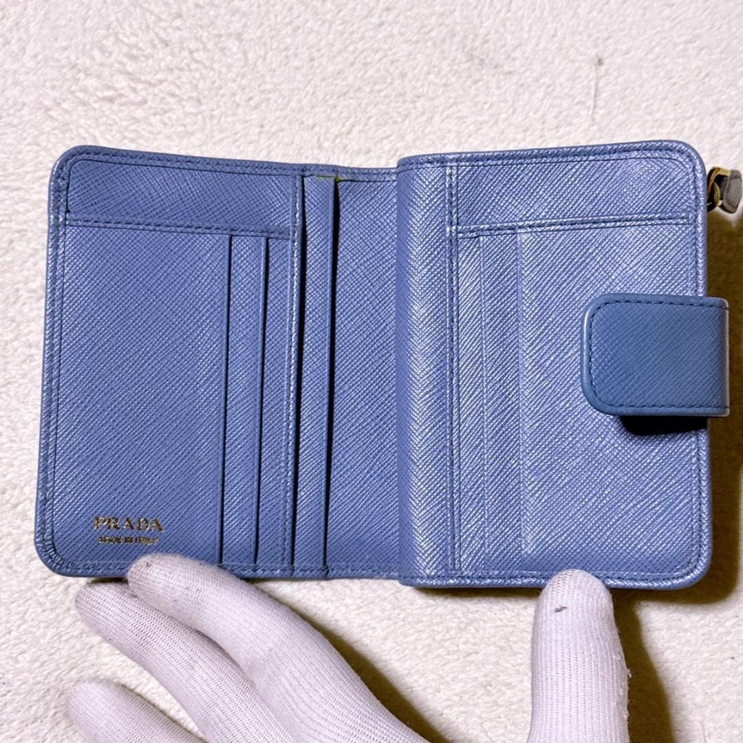 RFID【極美品】プラダ 1ML018 サフィアーノ 折り財布 メタルロゴ 水色