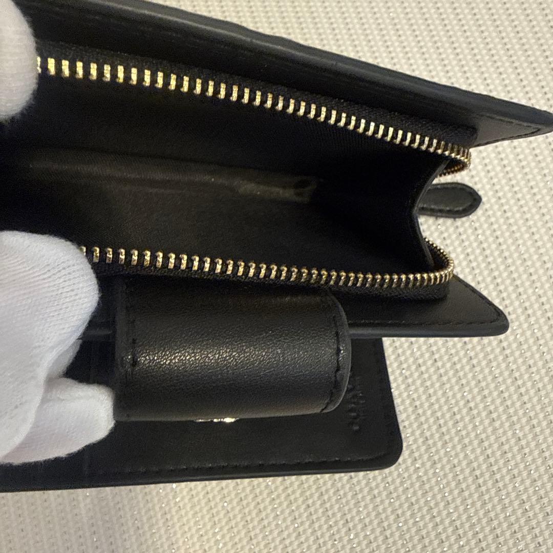 COACH 黒型押しレザー二つ折り財布