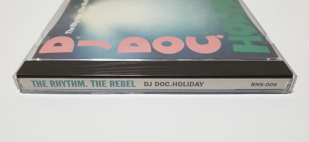 DJ DOC. HOLIDAY / The Rhythm. The Rebel