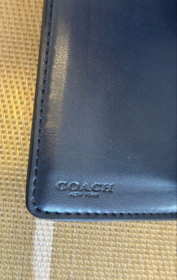 新品未使用 COACH コーチ 二つ折り財布 ベージュ シグネチャー