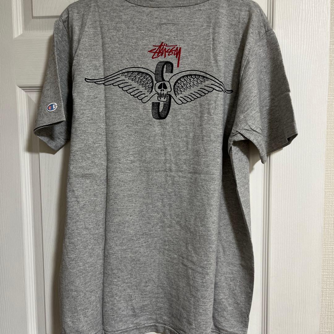 値下げ中StussyとChampionのコラボ　グレー Tシャツ 完全未使用