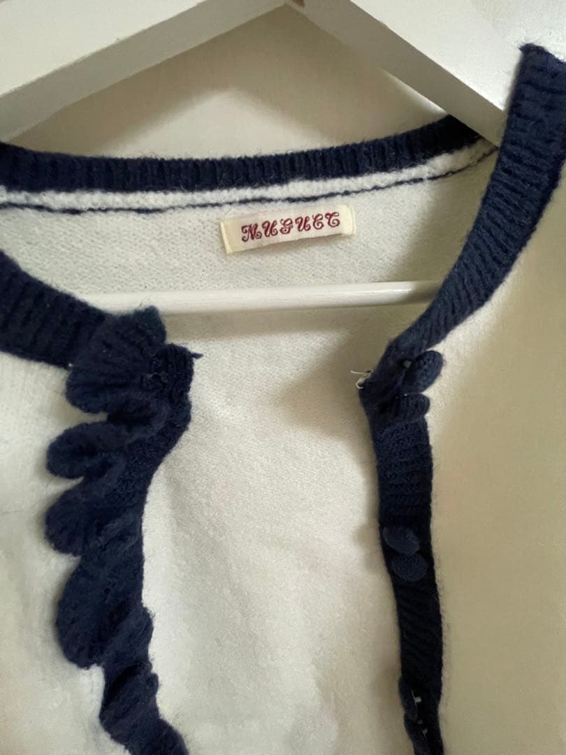 トップス muguet bicolor frill knit cardigan