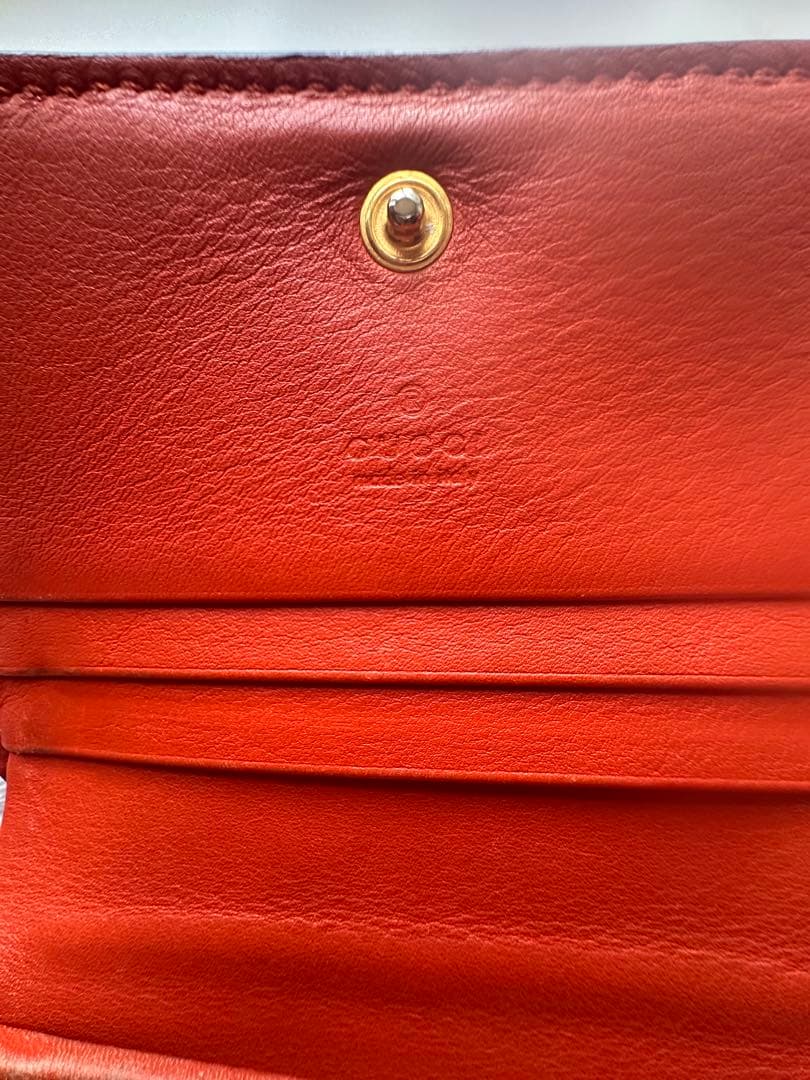 GUCCI ヘビ革 二つ折り財布 オレンジ　パイソン