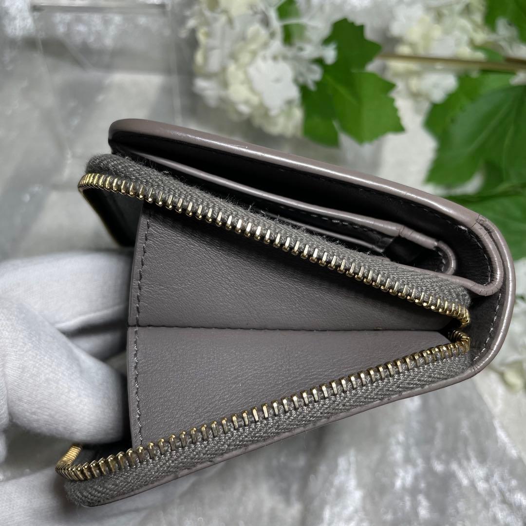 サンローラン 二つ折り財布 ラウンドジップ カサンドラ グレー YSL