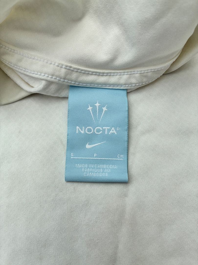 【中古】NOCTA NIKE モックネックシャツ ホワイト Sサイズ