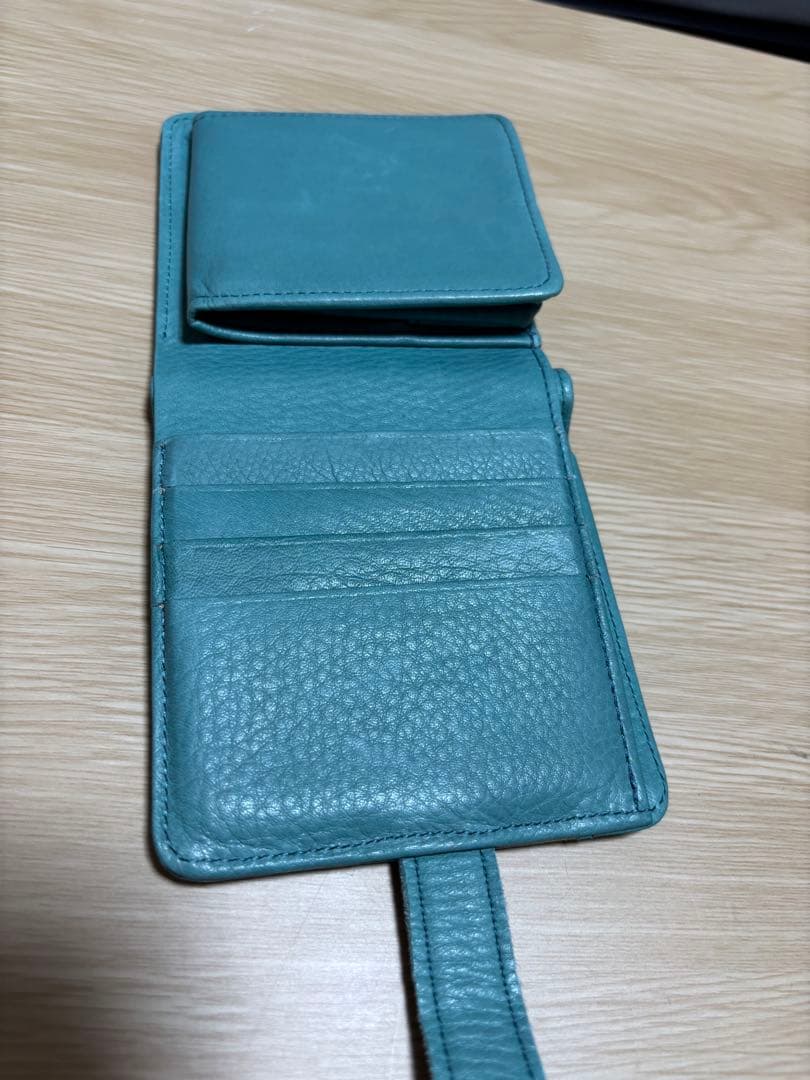 本革型押しミッキーモチーフ二つ折り財布