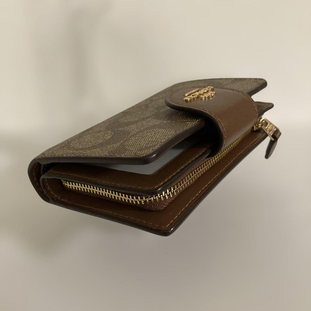 〔新品　未使用〕COACHコーチ　シグネチャー 二つ折り財布