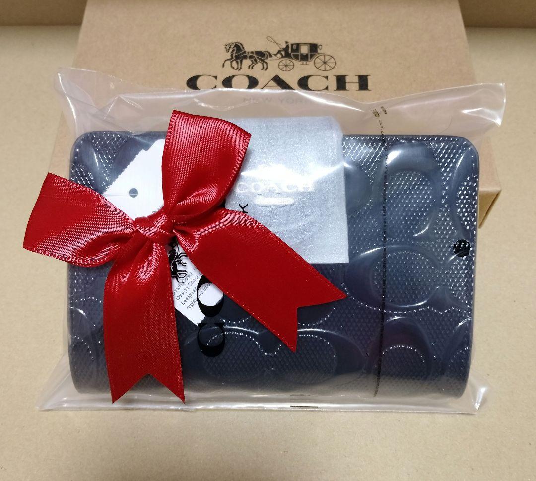 【オープン価格】COACH シグネチャーエンボス加工 二つ折り財布
