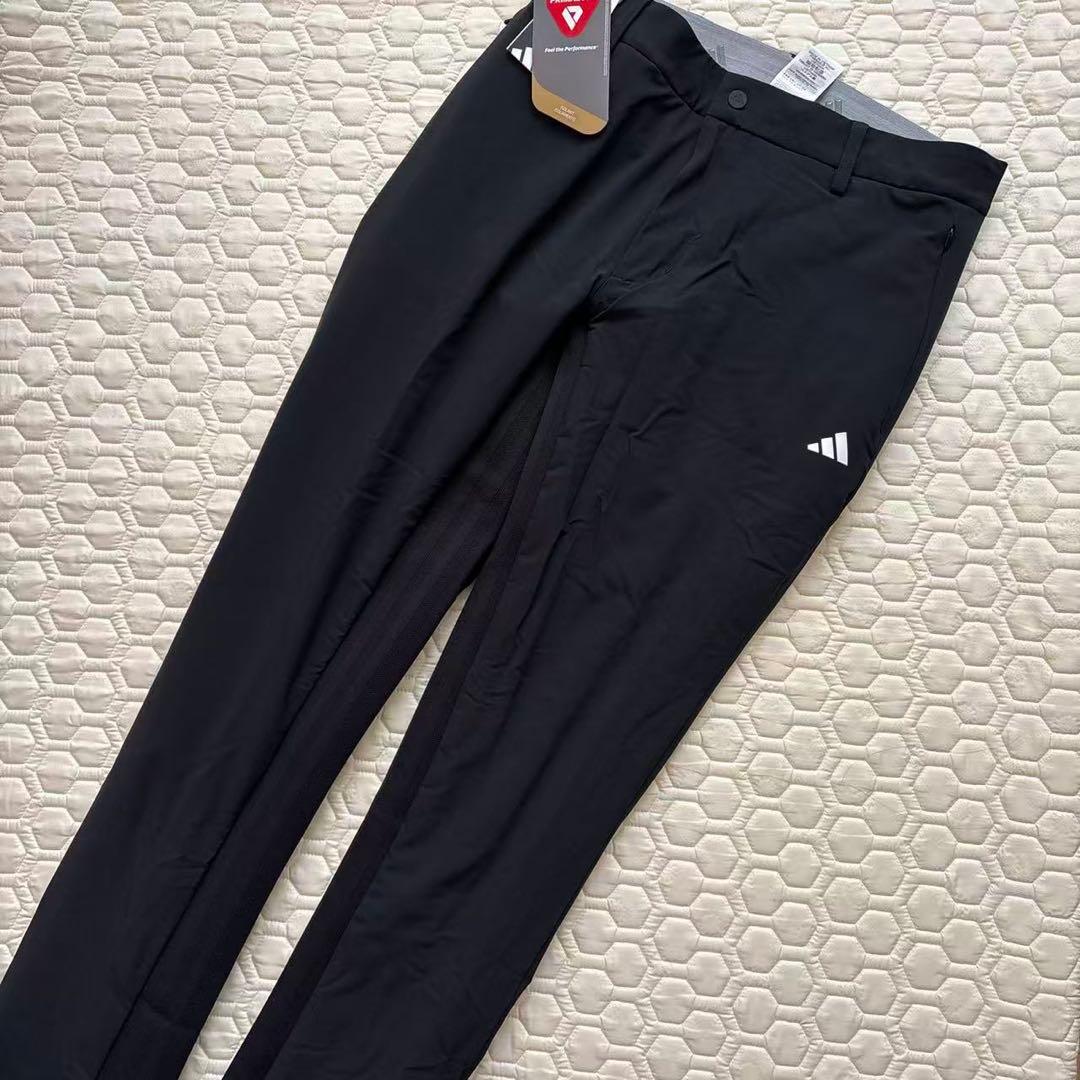 79新品27500円アディダスゴルフ/メンズ/秋冬/中綿ストレッチパンツ/黒