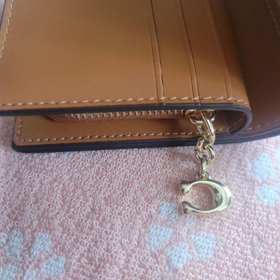 COACHコーチシグネチャースヌーピーコラボ二つ折り財布