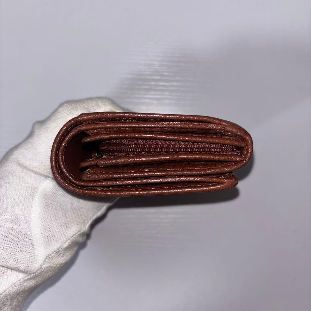 0077 新品、未使用 COACH レザー 金馬車ロゴ 折り財布