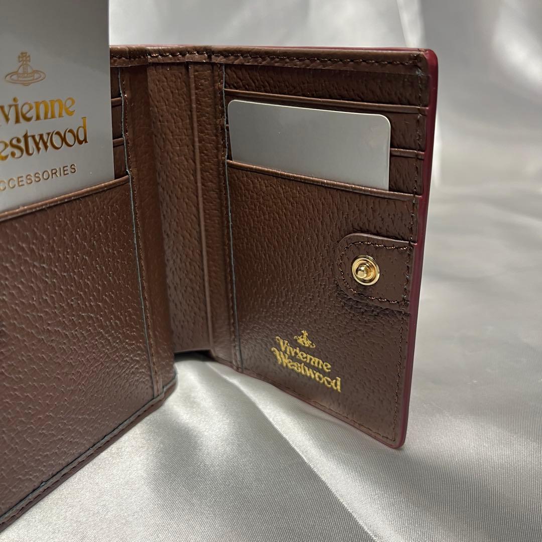 新品Vivienne Westwood 茶 コーヒー 蝶々留め 二つ折り財布